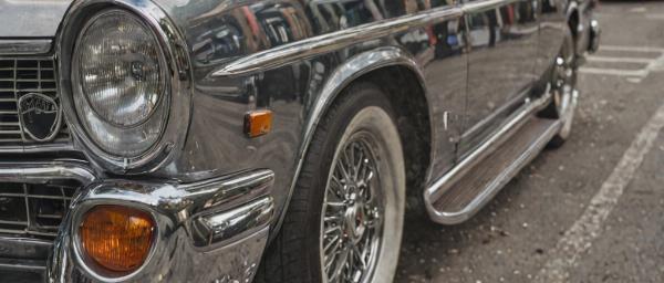 Classic car chrome restoration project showing mirror finish bumpers